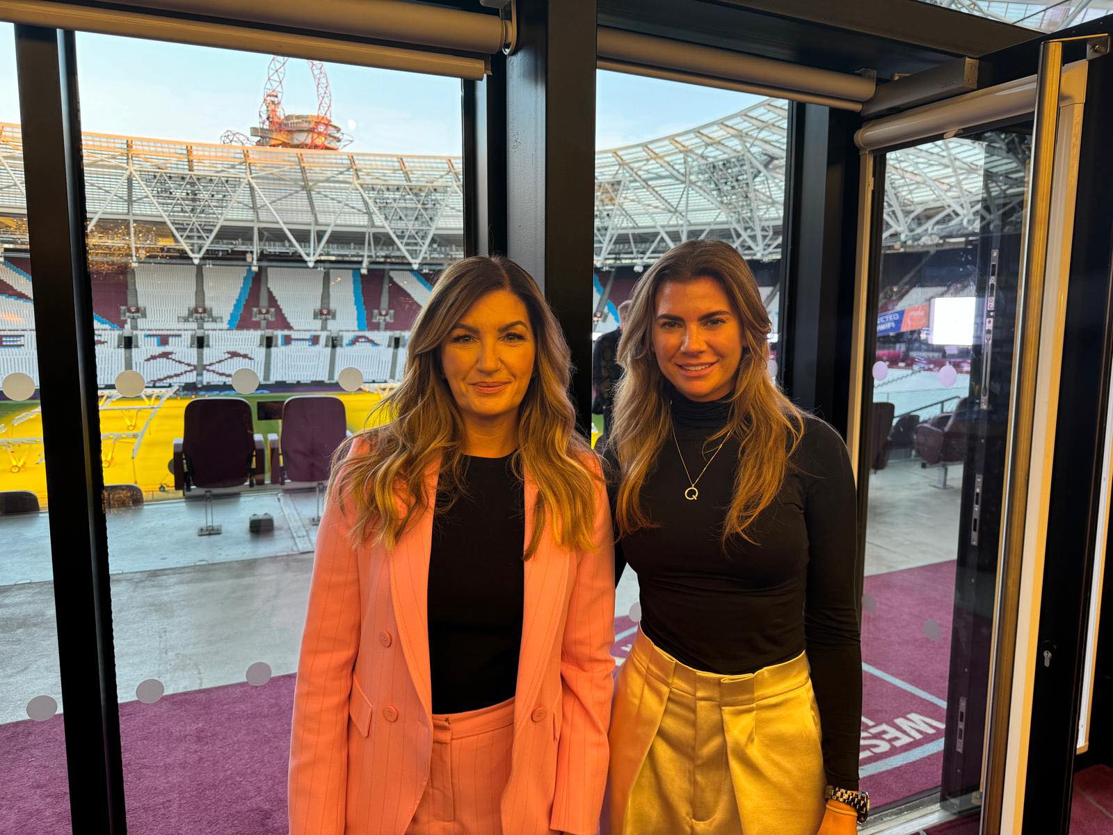 Founder Queenie Porter standing next to Karen Brady smiling
